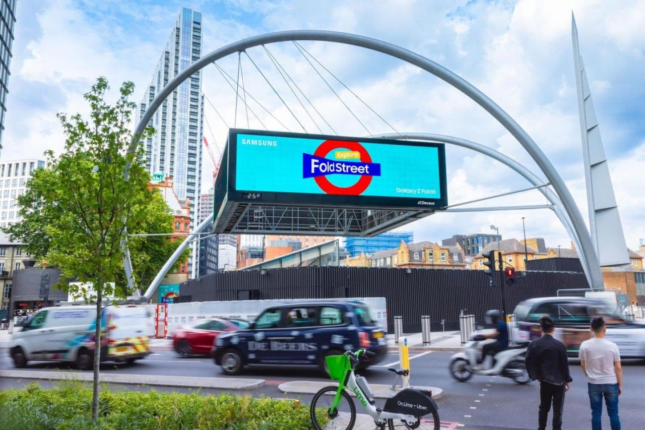 Large digital billboard above a busy city junction