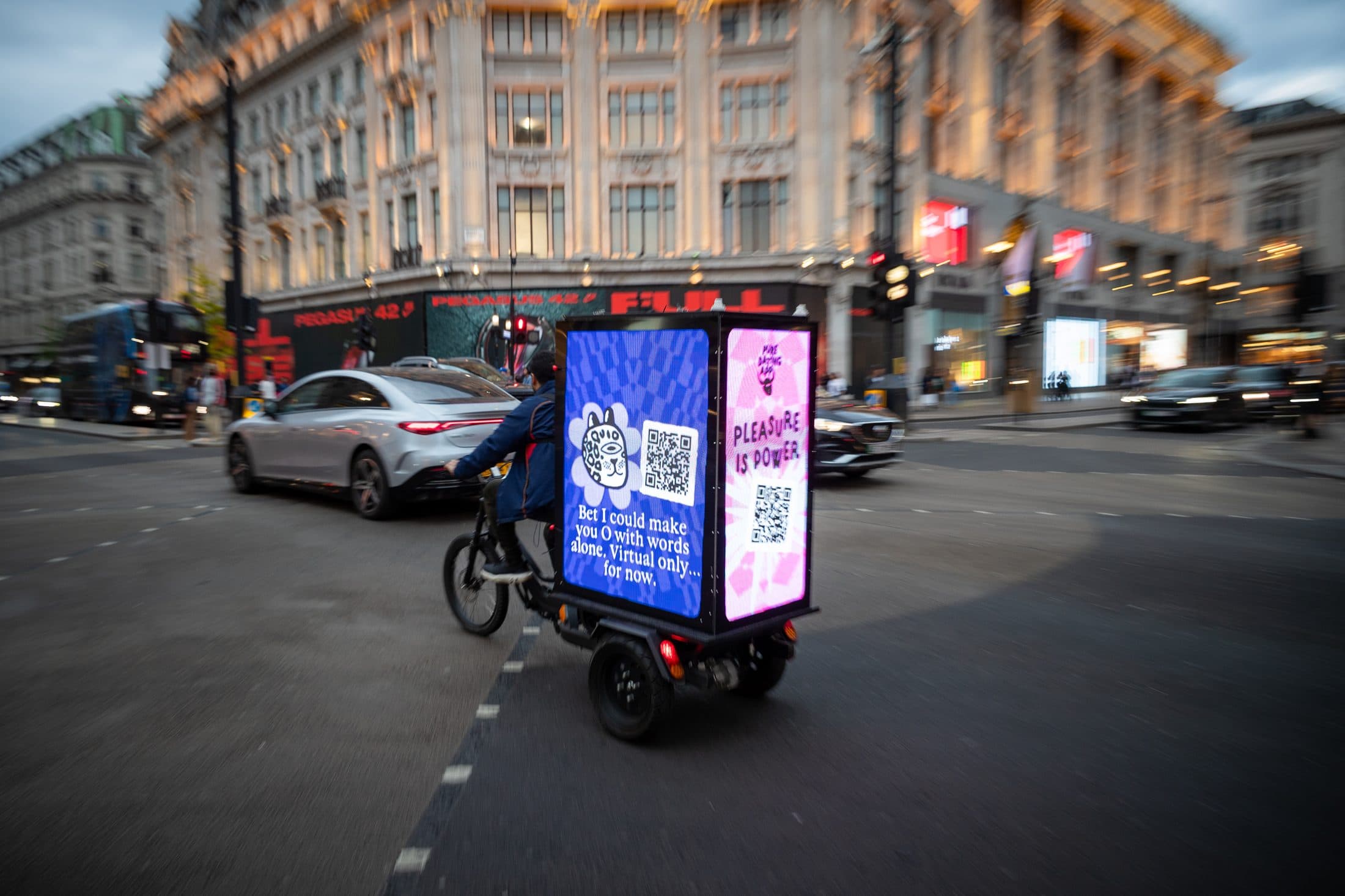Pure Digital AdBike with 3D lips build on Regent Street at dusk