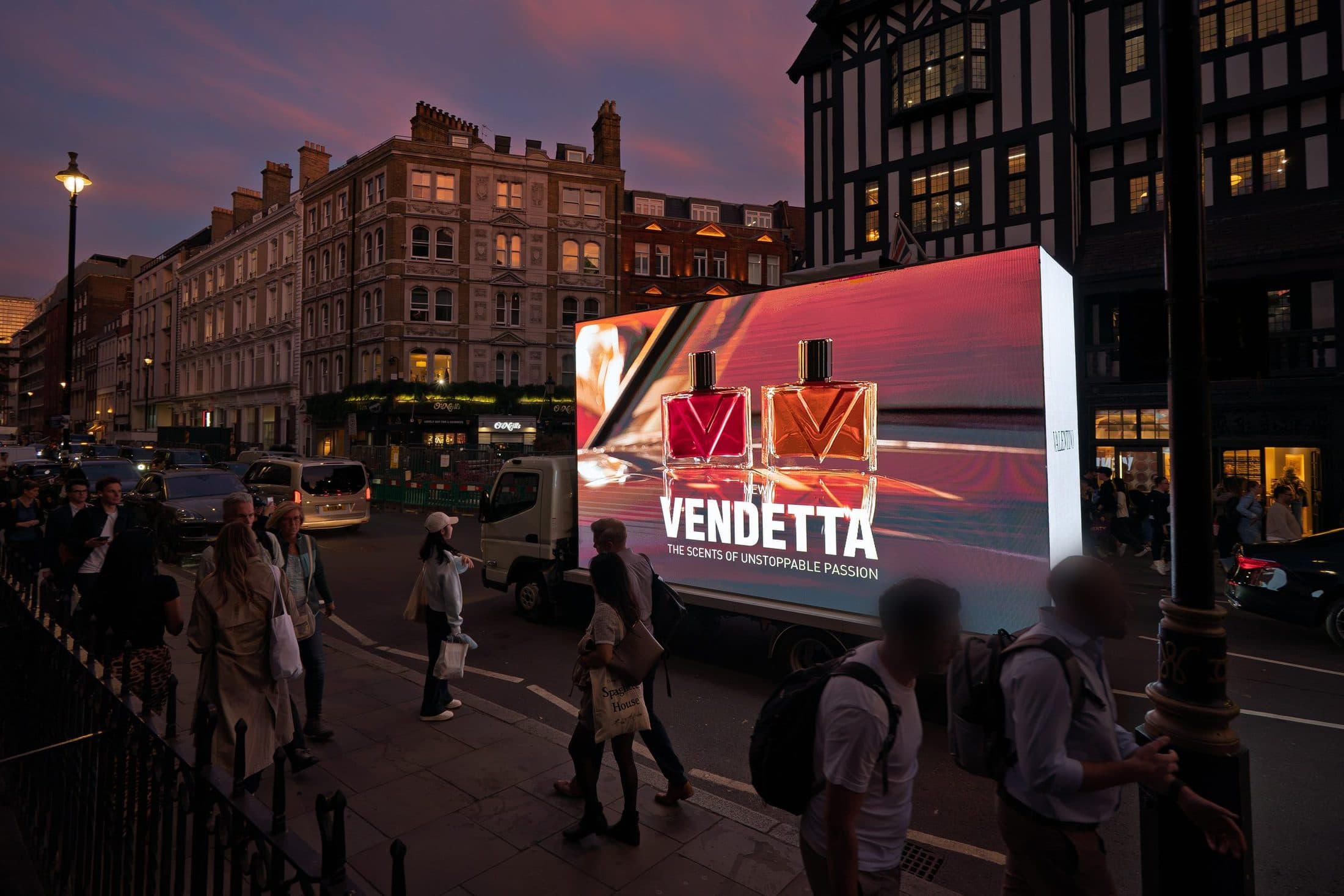 A Monster Digital AdVan showing the two Vendetta bottles on Great Marlborough Street at the corner of Carnaby Street at dusk