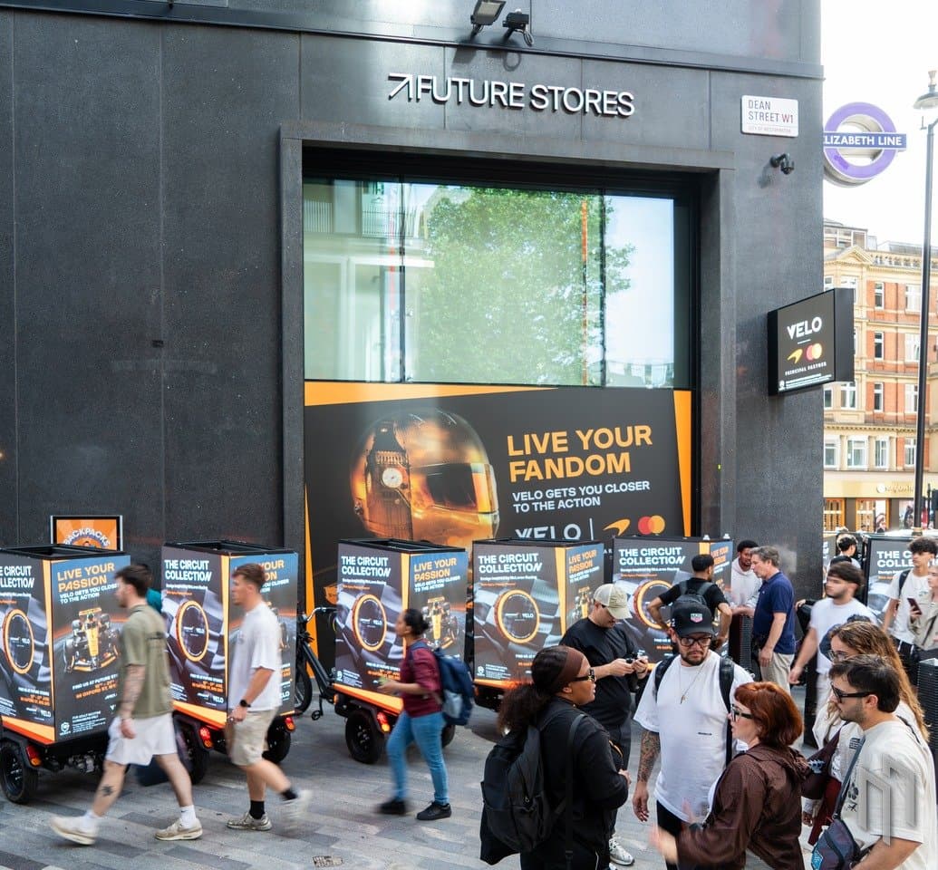 Crowds passing the Velo x McLaren AdBikes at Future Stores on Oxford Street