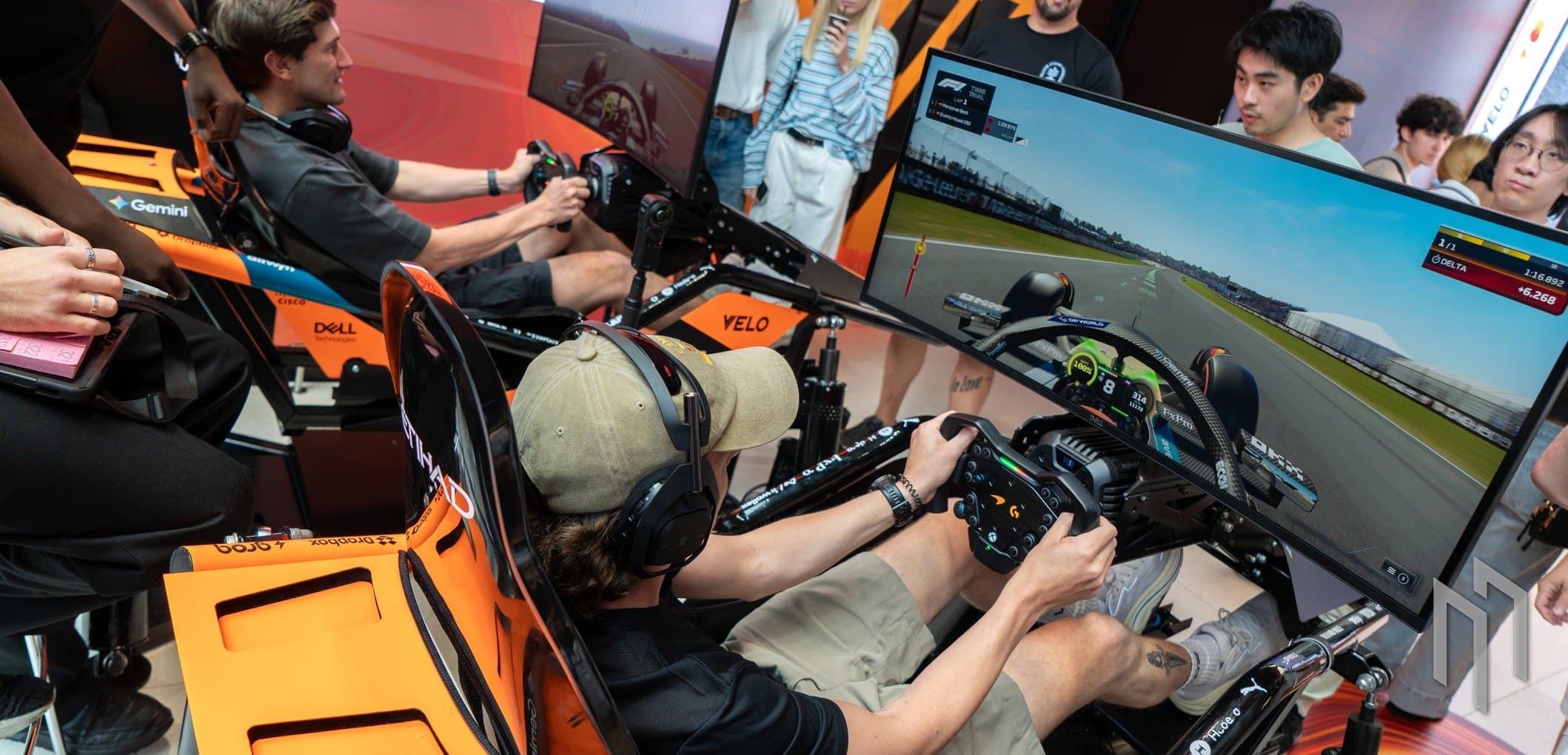 Fans on the sim racing rigs inside the Velo x McLaren Future Stores pop-up