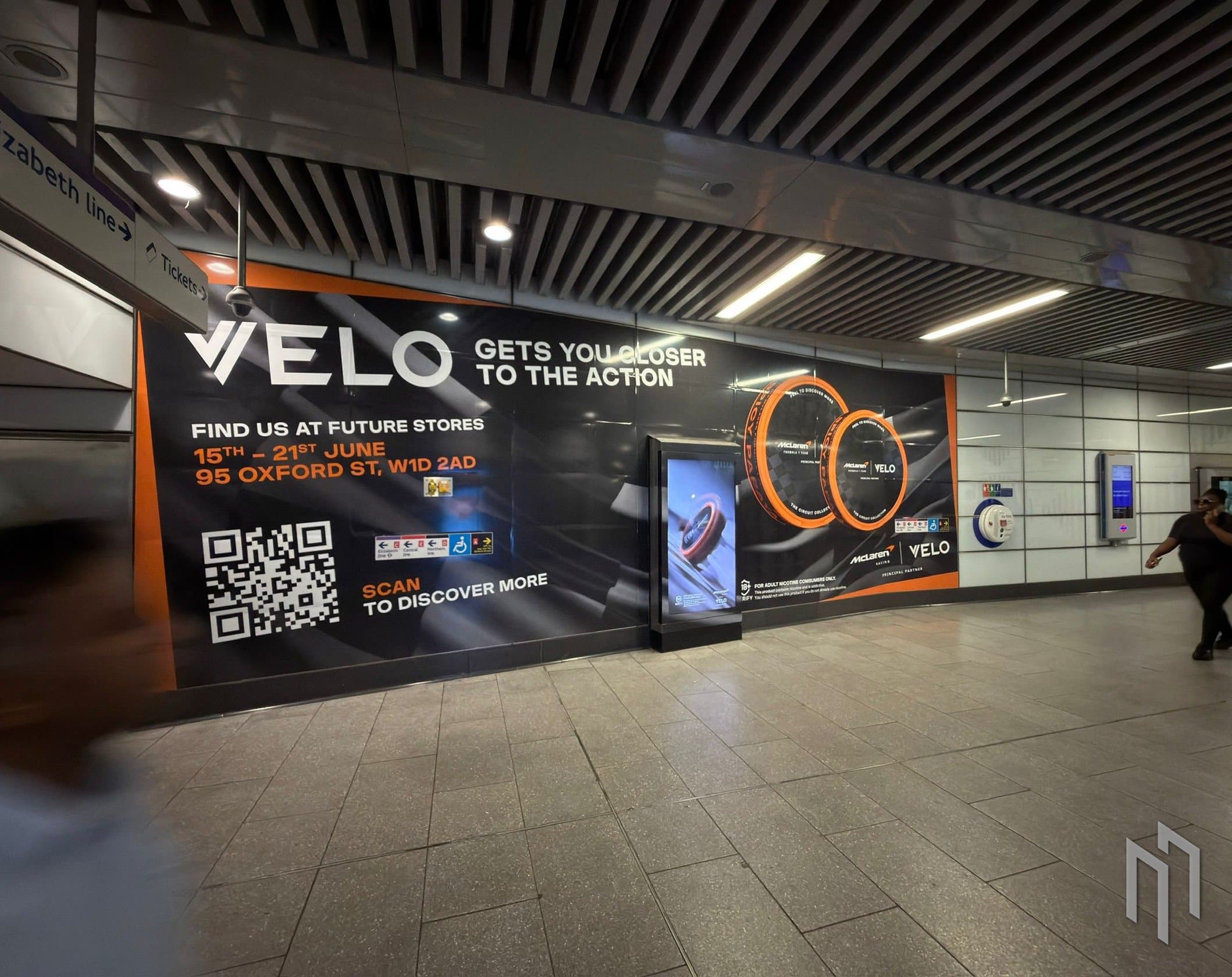 Velo x McLaren Underground takeover wall on the Elizabeth line at Oxford Street
