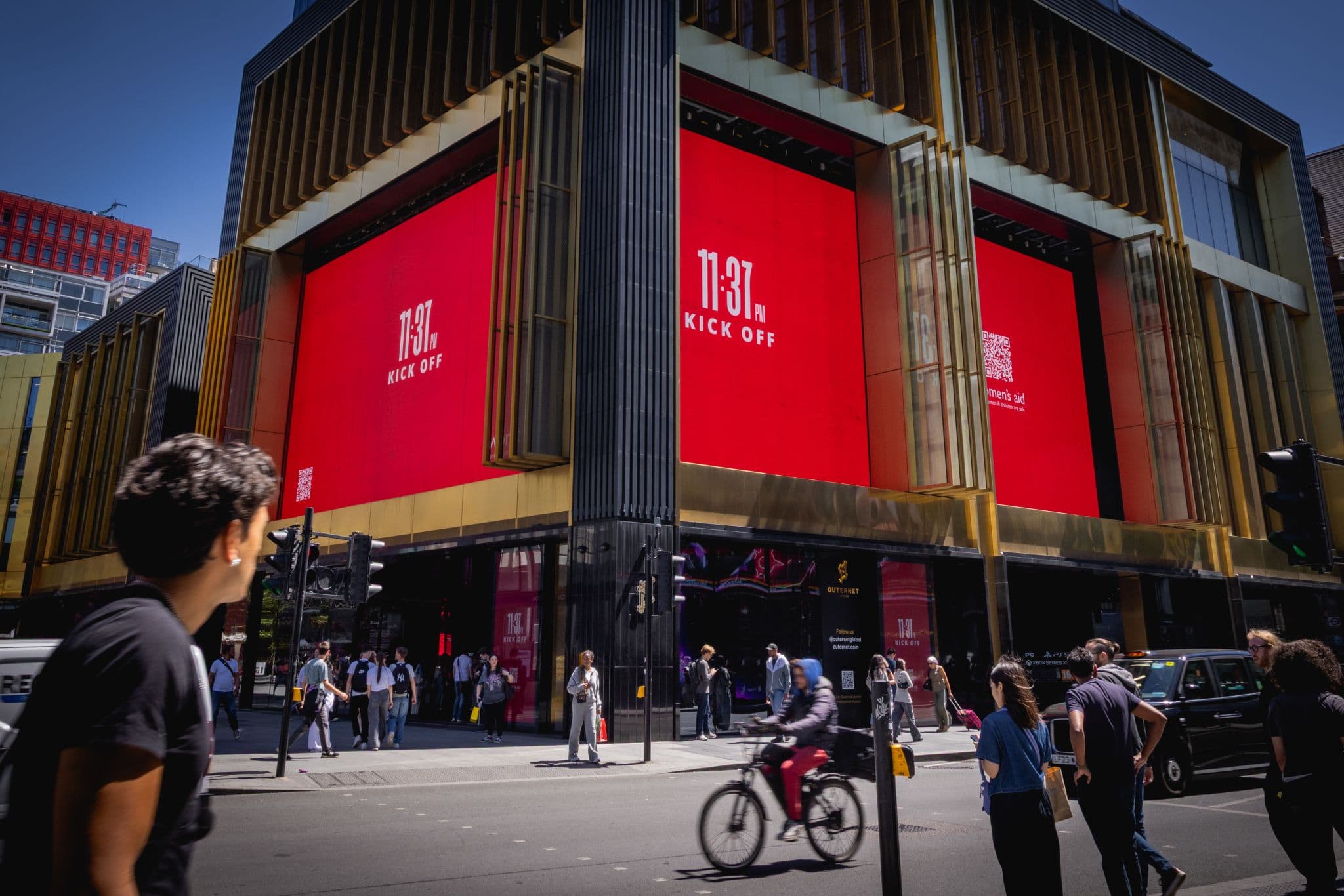 The Women's Aid 'Other Kick Off' campaign covering the giant Outernet London screens at Tottenham Court Road