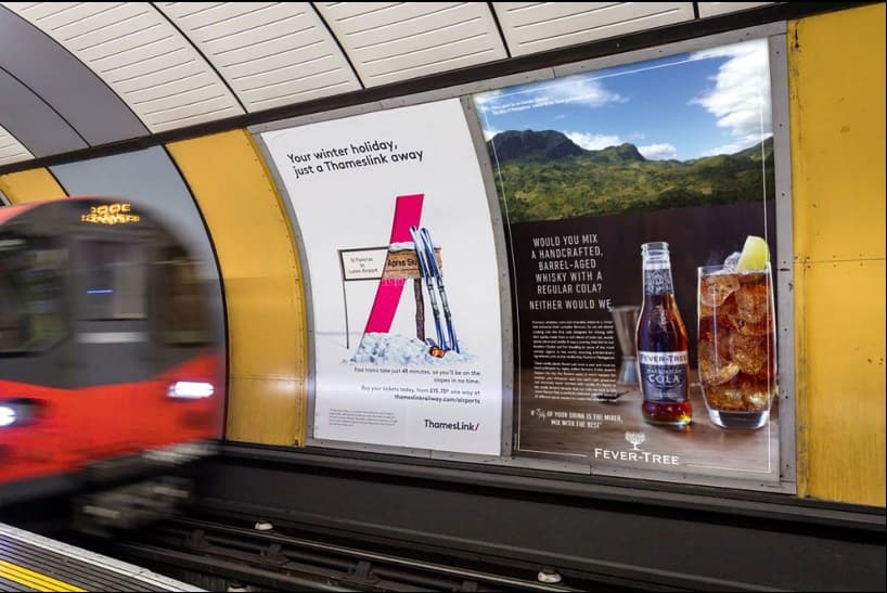 16-sheet cross-track poster facing a London Underground platform