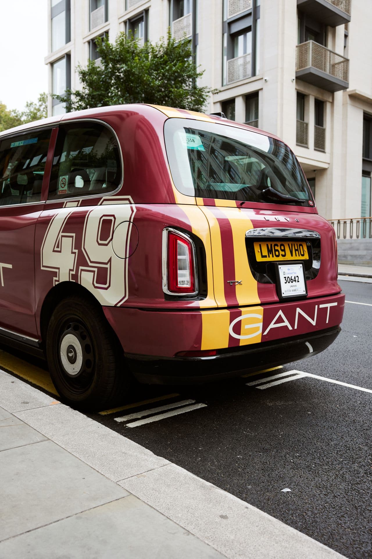 GANT branded electric taxi parked kerbside in London