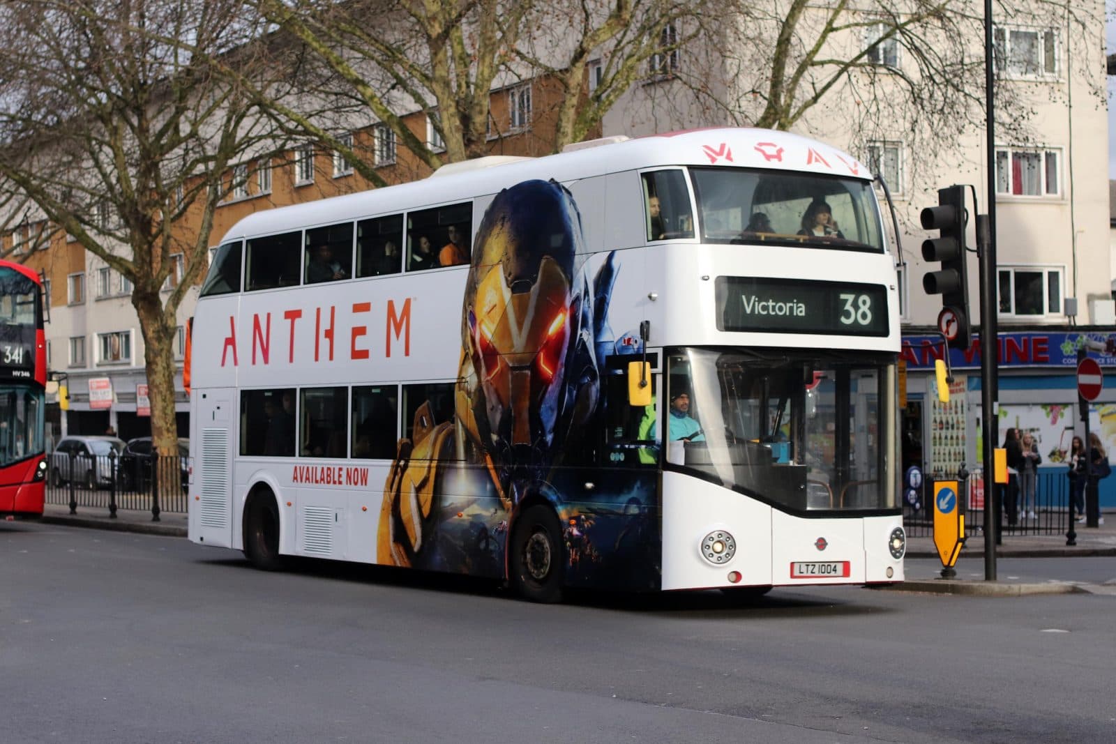 Full bus wrap advertising on a London route 38 double-decker bus heading to Victoria