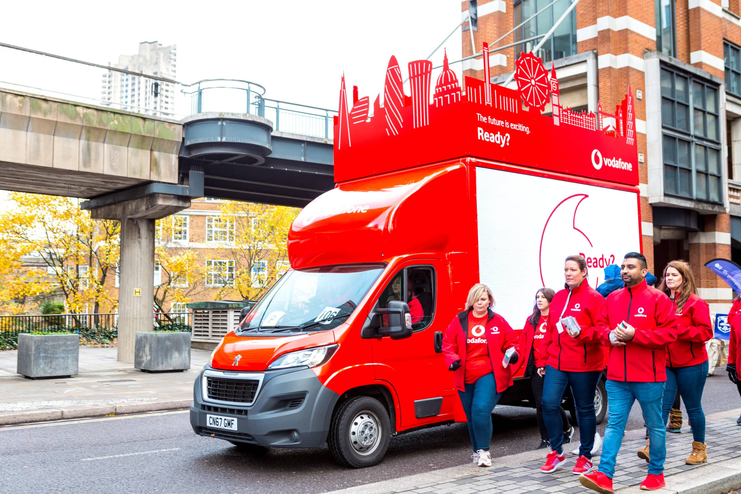 Digital ad van with LED screen displaying advertising on UK street
